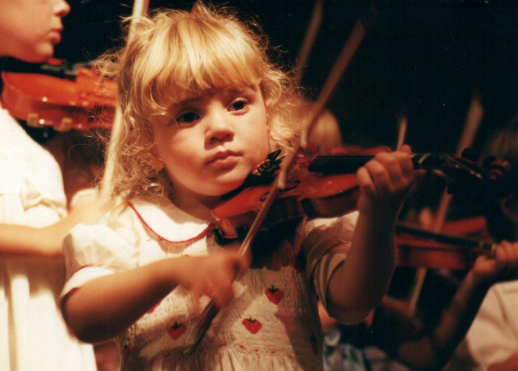 Young child playing violin